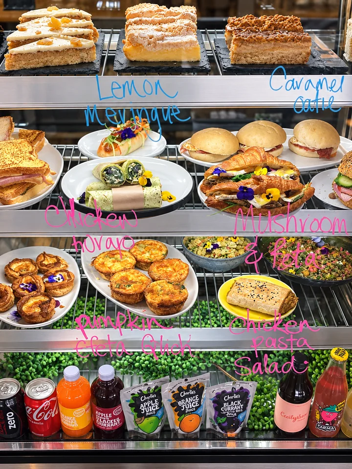 Pastries, sandwiches and drinks in the display case